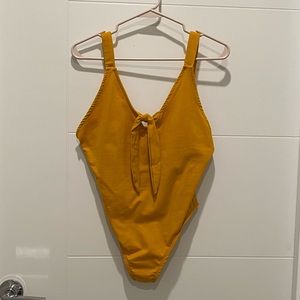 Yellow bodysuit